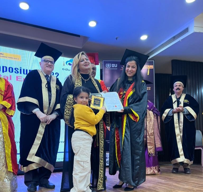 Dr. Jyoti receiving an honorary award at an international symposium